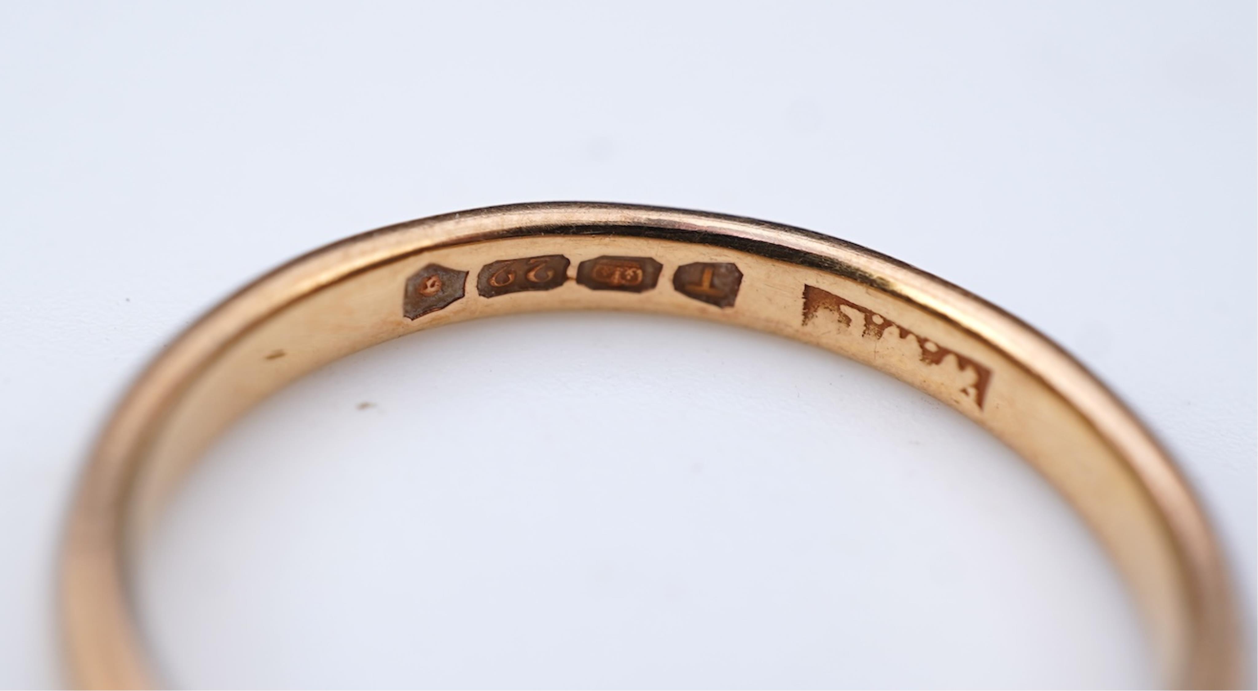 A collection of six gold wedding bands